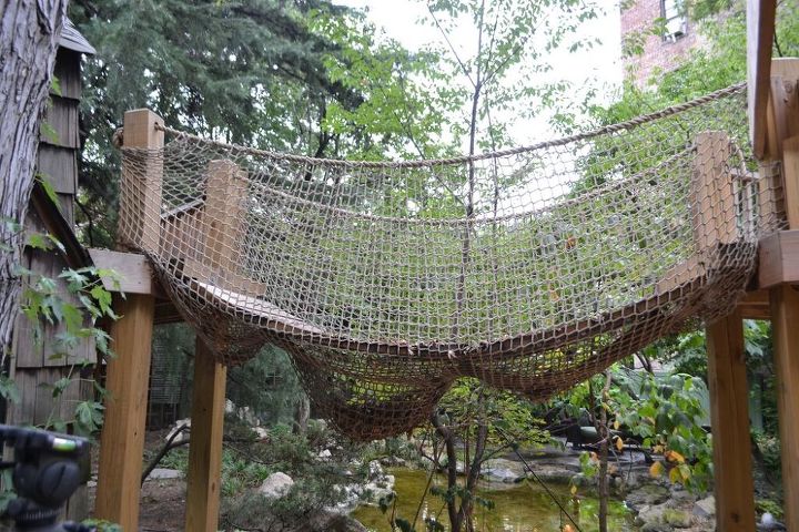 natural playscapes pond and playground oasis in city backyard, Backyard Rope Bridge