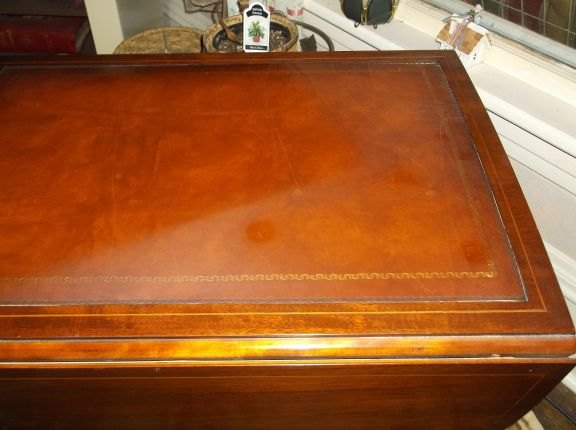 how do i clean a leather top on a table