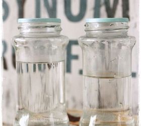 reuse empty spice bottles as whimsical bud vases