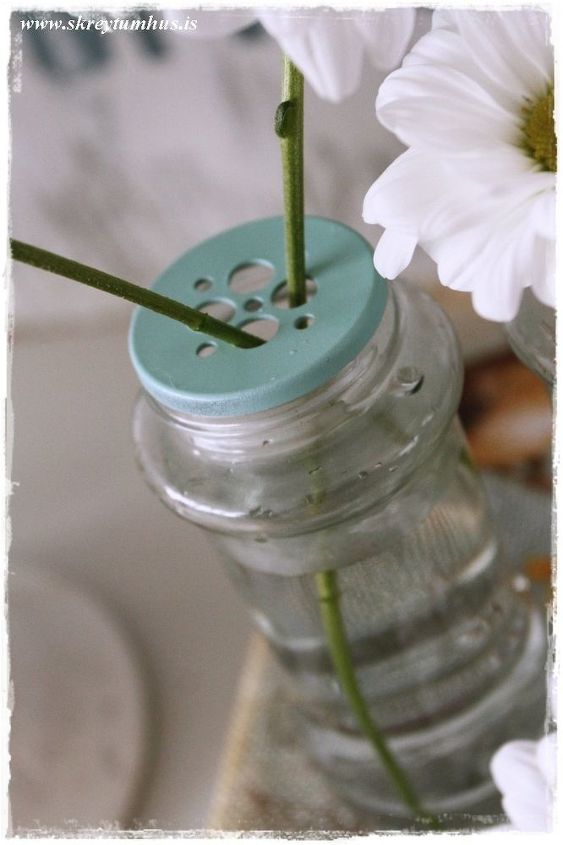 reuse empty spice bottles as whimsical bud vases