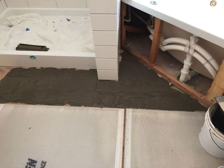 carpeted bathroom gets a new tile floor