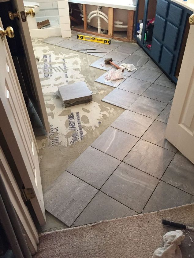 carpeted bathroom gets a new tile floor
