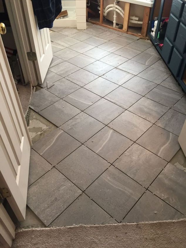 carpeted bathroom gets a new tile floor