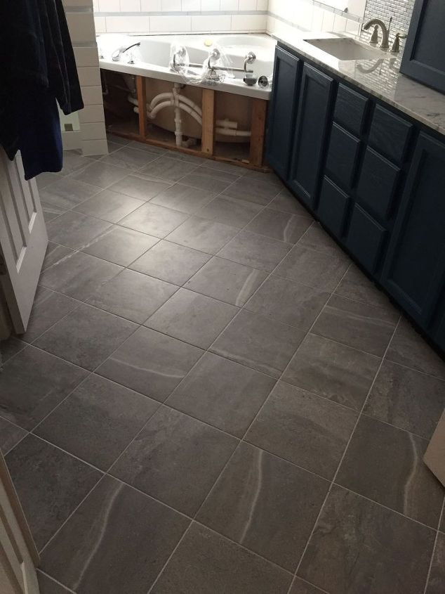 carpeted bathroom gets a new tile floor