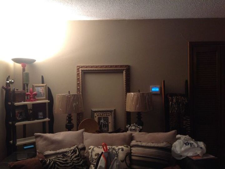 q living room wall, home decor, living room ideas, wall decor, I have a sofa table behind my couch it s a sectional only place it works in my living room one wall has a collage on it TV wall has doorframe with pictures on it with sconces on each side one wall has a mirror and table and the other is a window with curtains with wall space on both sides HELP sounds like a mess