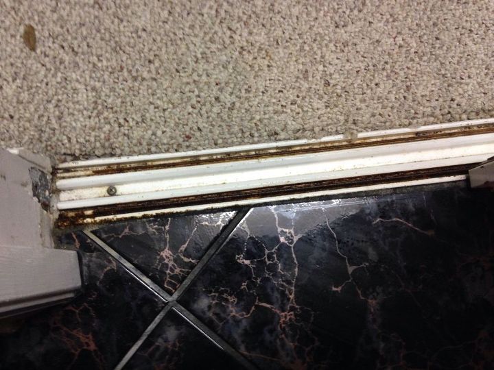 q replace old sliding doors to walk in closet, closet, doors, how to, This is the track it runs on Tile in bathroom and carpet in walk in closet
