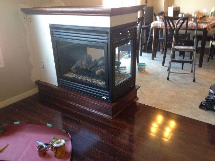 we removed a half wall and added a 3 sided fireplace