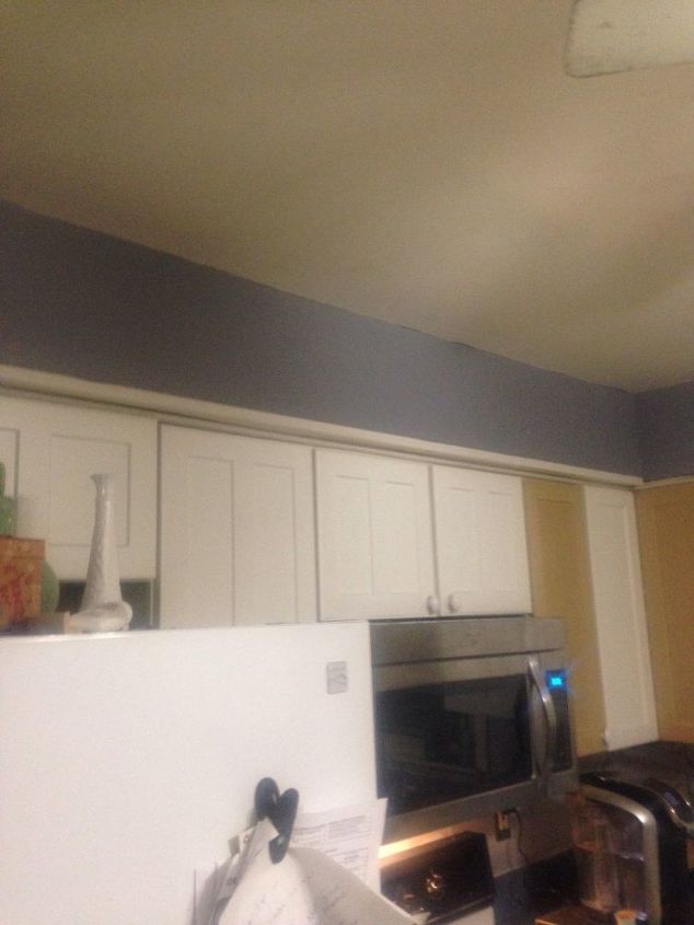 q faux brick wall and backsplash, cosmetic changes, home improvement, wall decor, I ve started on my kitchen and went with a medium grey for the soffets and pass through wall to the living room