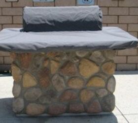 grill island covers, outdoor living, Outdoor gas grill with a stone base covered with a black grill cover top