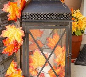 s 10 easy breezy ways to bring fall into every room, home decor, seasonal holiday decor, Add a Lantern Full of Fall to Your Porch