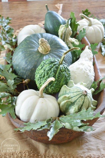 s 10 easy breezy ways to bring fall into every room, home decor, seasonal holiday decor, Place a Bowl of Gourds on the Coffee Table