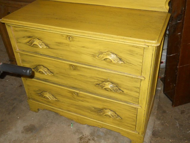 best way to accent decorative wooden drawer pulls on antique dresser