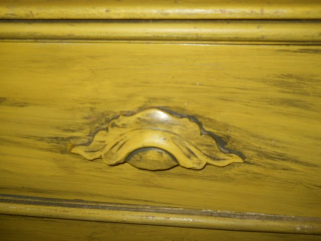 best way to accent decorative wooden drawer pulls on antique dresser