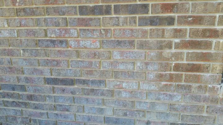 how do we clean water stained exterior bricks, The bricks are all whitish get from water constantly spraying them They should be red like the bricks in the upper right hand corner