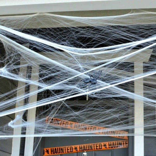 s how to scare your neighbors in just 10 minutes, curb appeal, halloween decorations, seasonal holiday decor, Cover Your Porch Ceiling in Webs