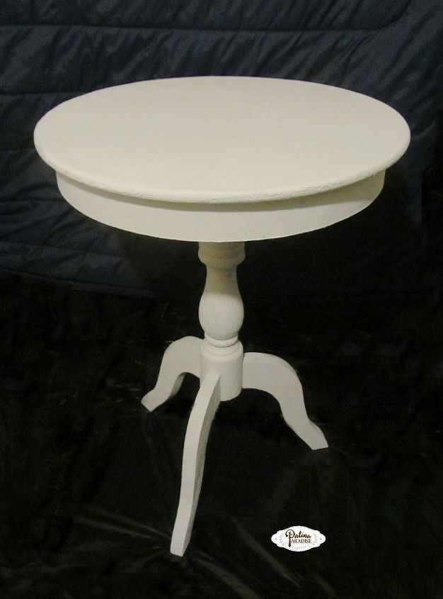 mesa con pedestal y acabado envejecido