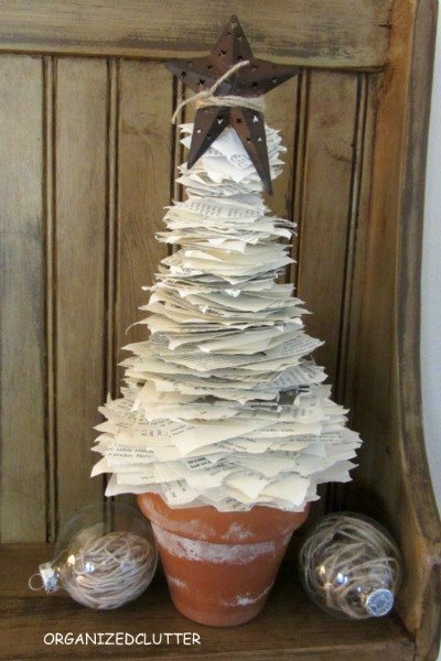 s 20 fake christmas trees you ll wish you d seen sooner, christmas decorations, repurposing upcycling, seasonal holiday decor, Book Page Pile up