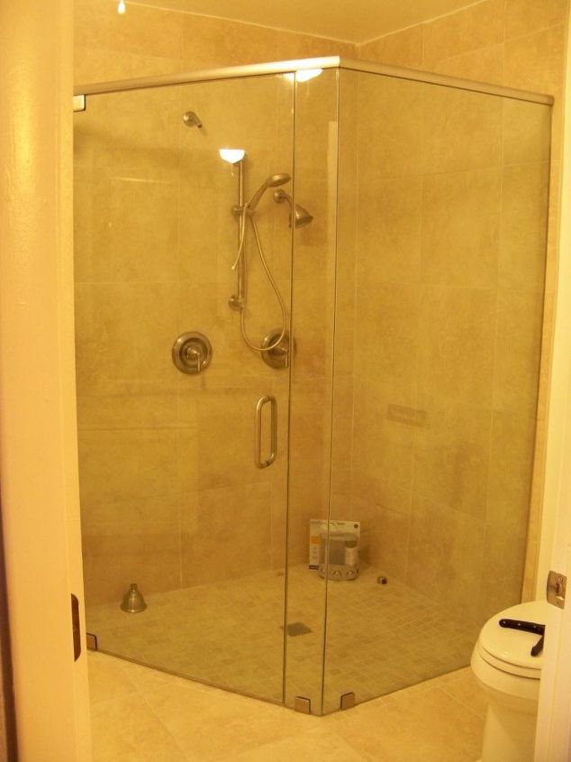 what is the best way to keep my glass shower doors clean, We later added a teak fold down seat which helps alot too You can see we have alot of glass to keep clean lol