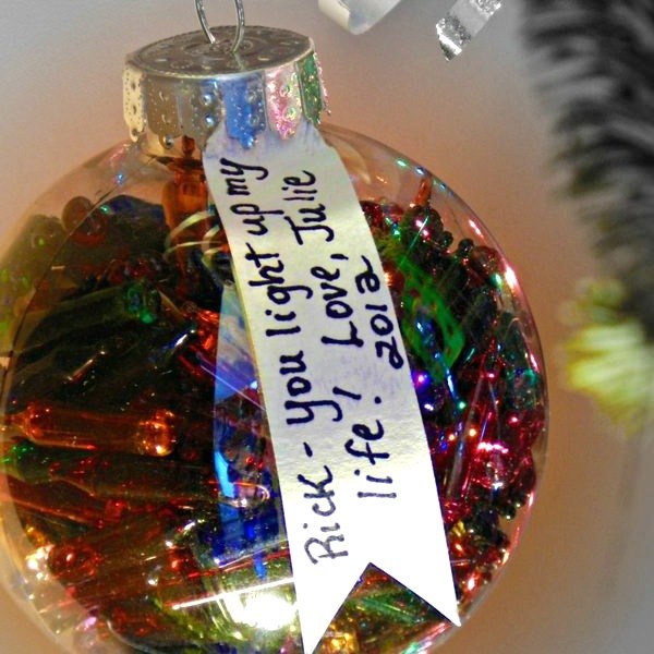 s 23 breathtaking ways to dress up a plain plastic or glass ornament, crafts, Fill one with last year s Christmas lights