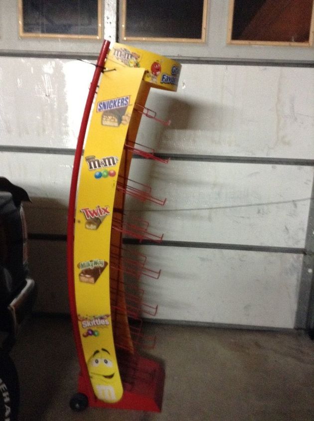 q what could i do with this candy rack, crafts, diy, repurpose unique pieces, repurposing upcycling, storage ideas, Metal candy rack on wheels with wire shelves The yellow sides are plastic and can be removed or painted