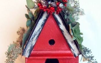  Uma casa de pássaros de Natal com um telhado de suculentas brilhantes e vívidas