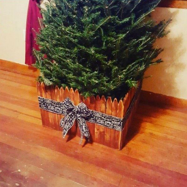 s 7 brilliant ways to protect your christmas tree from toppling, christmas decorations, seasonal holiday decor, Surround Your Tree with a Fence