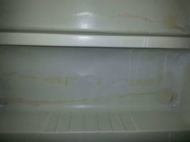 ugly tub surround, This is a close up of the soap dish area where it looks like the adhesive ate through and was later fixed with putty UGH