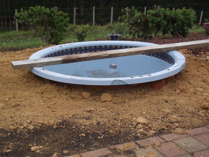 upcycling an old spa into a fishpond fountain