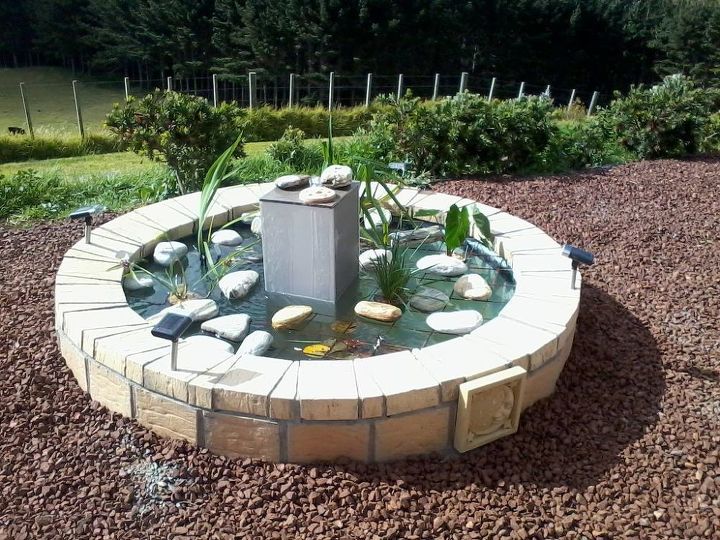 upcycling an old spa into a fishpond fountain