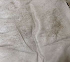 How can I get rid of a red pillow stain on a white leather couch?