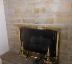 adding a mantel to a stone fireplace adds some real character, concrete masonry, fireplaces mantels, Before picture with brass andirons screen