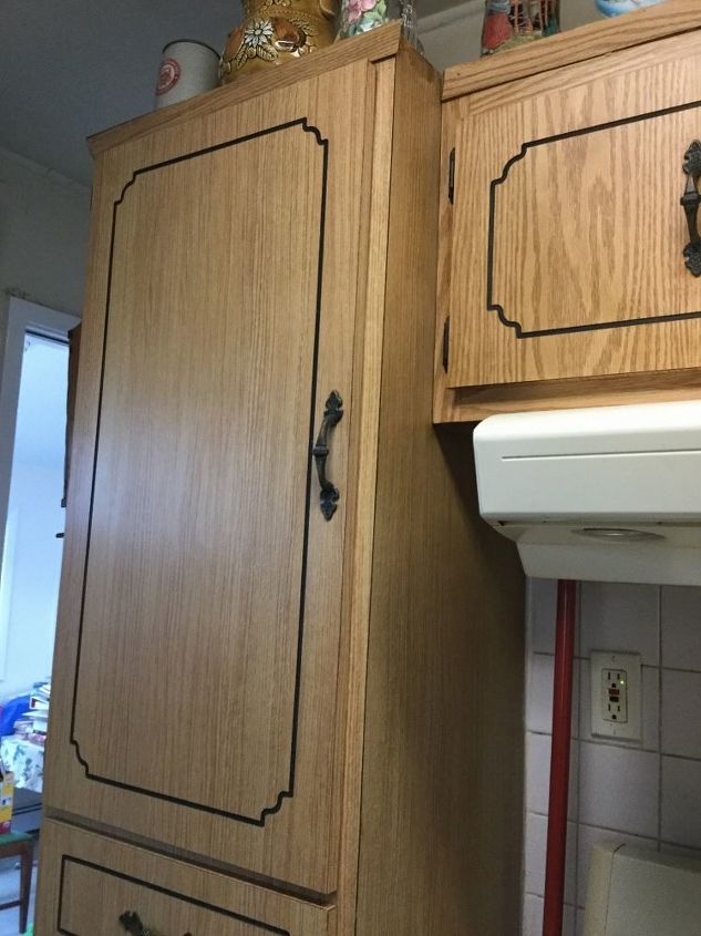 refacing formica kitchen cabinets and counters, Large pantry on left small upper cabinets with four doors they run across the top There is another pantry on the right about half the width of this one