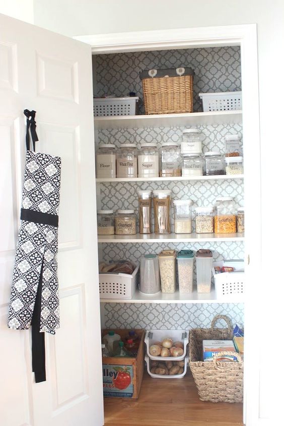 s 23 insanely clever ways to eliminate clutter, organizing, storage ideas, Give Your Pantry a Clean Look With Wallpaper