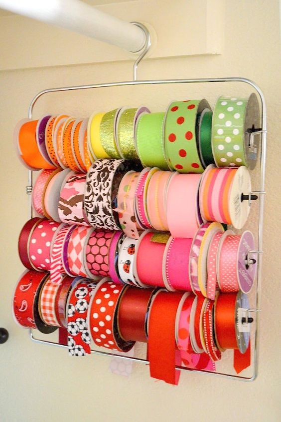 s 23 insanely clever ways to eliminate clutter, organizing, storage ideas, Keep Ribbon Spools on a Pants Hanger