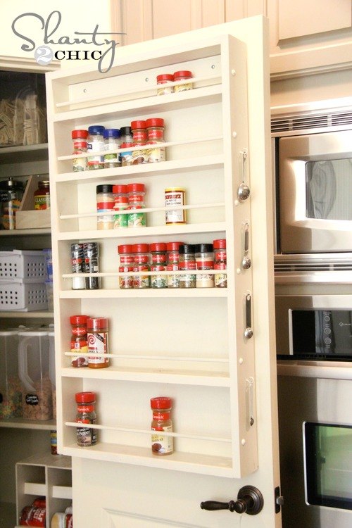 s 23 insanely clever ways to eliminate clutter, organizing, storage ideas, Put a Spice Rack on Your Pantry Door