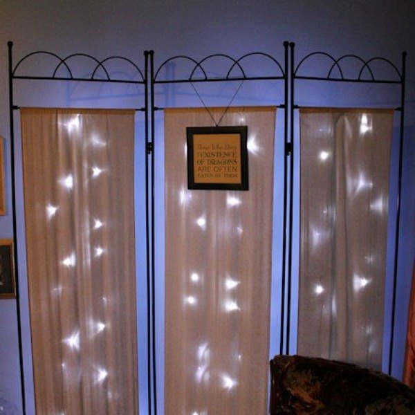 s 14 string light ideas that are cozier than your bed, bedroom ideas, lighting, Shimmering Room Divider