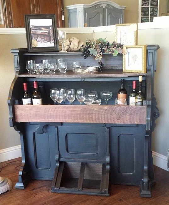 1800 s eastlake pump organ repurposed into a wine bar