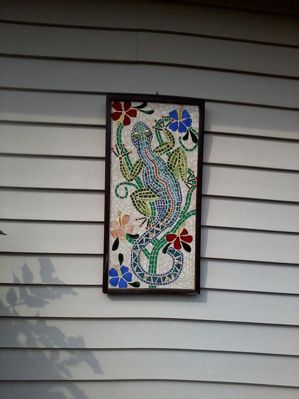 custom mosaic on hardi backer board, home decor, tiling, this is a mosaic that hangs on my house it s stained glass on wood