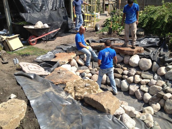 pond rehab in chicago a tree fell in and did a lot of damage, home maintenance repairs, outdoor living, ponds water features, Boulders are placed on the ledges Weathered out cropping stone will be used on the outer edge and for the waterfall