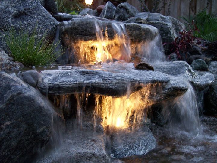 underwater lighting in a waterfall, lighting, outdoor living, ponds water features, Double the impact or your water feature by adding lights for an after dark experience