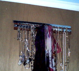 new use for tie rack, It is hidden behind my bedroom door I use it to organize my necklaces bracelets and scarves It has both hooks w caps and loops which swing open for easy removal and closes to keep items secure