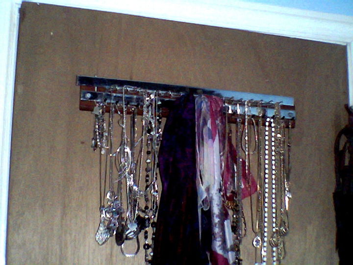 new use for tie rack, It is hidden behind my bedroom door I use it to organize my necklaces bracelets and scarves It has both hooks w caps and loops which swing open for easy removal and closes to keep items secure