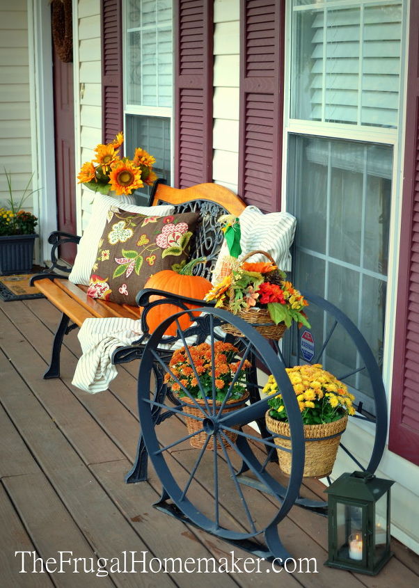fall front porch, curb appeal, porches, seasonal holiday decor, enjoyed decorating with my new yard sale find a huge iron wagon wheel planter