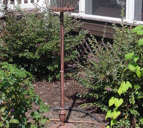 old wire egg basket and thrift store floor lamp stand repurposed into an outdoor