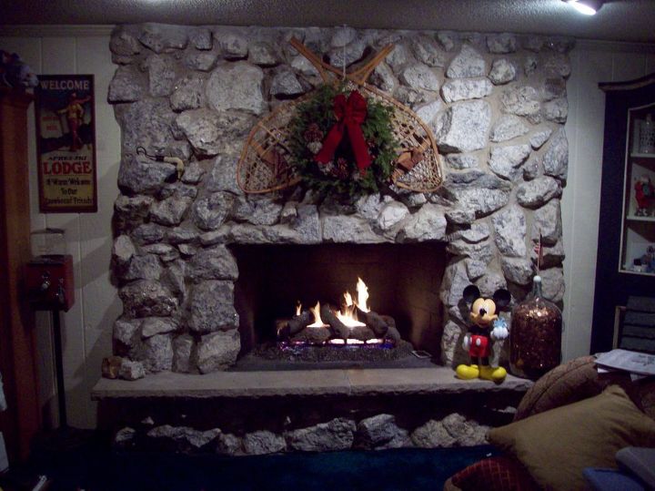 real stone fireplace should it stay or should it go i can t decide, fireplaces mantels, home decor, living room ideas, Here is it sorry the Christmas picture is the only one I currently have It is in great shape and the hearth is also in perfect working condition But is it too dated