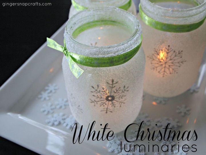 luminarias de navidad en tarros de cristal blancos