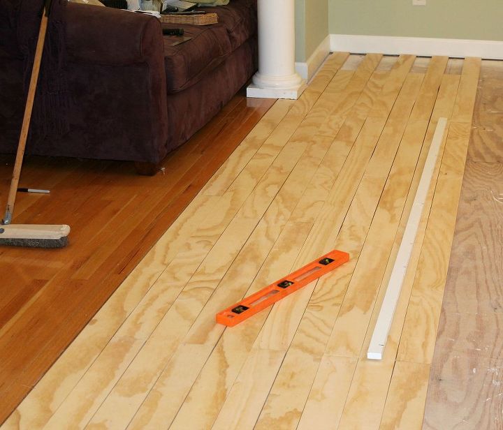 laying plywood floors, flooring, woodworking projects, We glued then nailed each board down