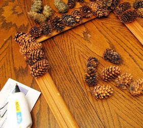 picture frame pine cone wreath, crafts, repurposing upcycling, seasonal holiday decor, wreaths, Glue gun old wooden frame a bit of ribbon and pine cones is all you need