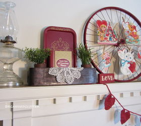 valentine s day mantel, christmas decorations, seasonal holiday d cor, valentines day ideas, Other items in the vignette include oil lamps a lantern doilies faux greenery a head vase a love sign a heart garland a sewing machine drawer a red tray a book and a felt red rose