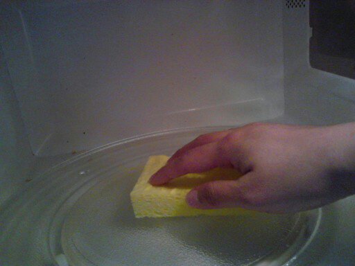 how to clean and disinfect the microwave with just vinegar and water, Step 4 Carefully open and remove the measuring cup or bowl Wipe the inside of the microwave clean with a damp sponge For stubborn stains dipping your sponge in the remaining vinegar and water mixture careful not to burn yourself